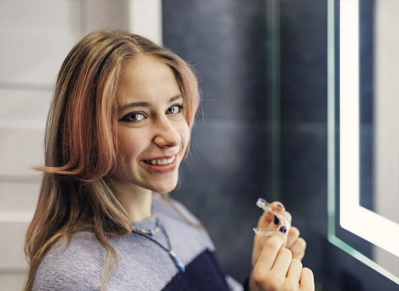 woman with clear aligner at North Jersey Dental Group