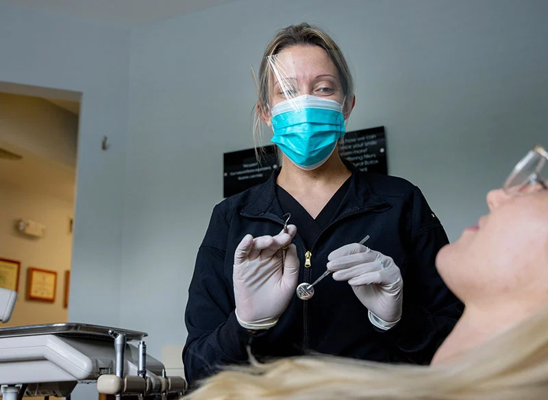 Dental Hygenist performing a routine cleaning on a patient at North Jersey Dental Group in Fort Lee, NJ